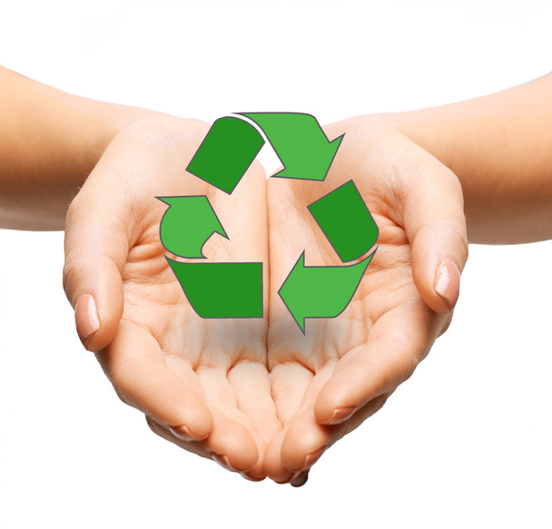 close up of hands holding green recycling sign - Φωτογραφία, εικόνα