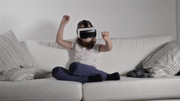 Girl wearing virtual reality goggles. - Кадры, видео
