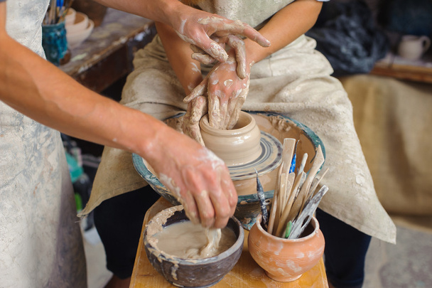 Potter teaches how make clay pot - Photo, image