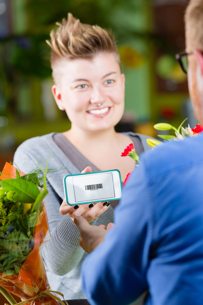 Youthful Flower Shop  Customer using Electronic Coupon - Photo, Image