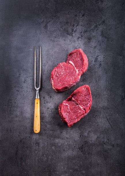 Steak. Raw beef steak. Fresh raw Sirloin beef steak sliced o Herb - Rosemary decoration - Zdjęcie, obraz