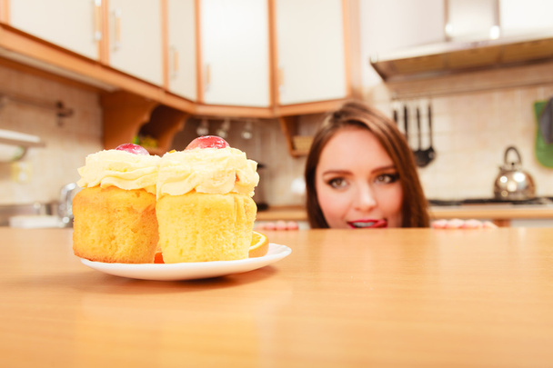 Woman looking at   cakes - Photo, image