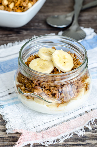 Granola, yoghurt and a banana in jar - Zdjęcie, obraz