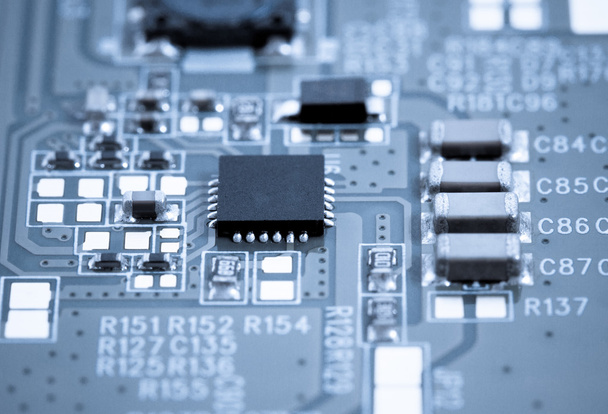 Circuit board with microchip closeup - Foto, afbeelding