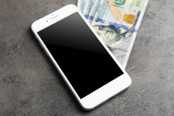 Mobile phone and money  - Foto, afbeelding