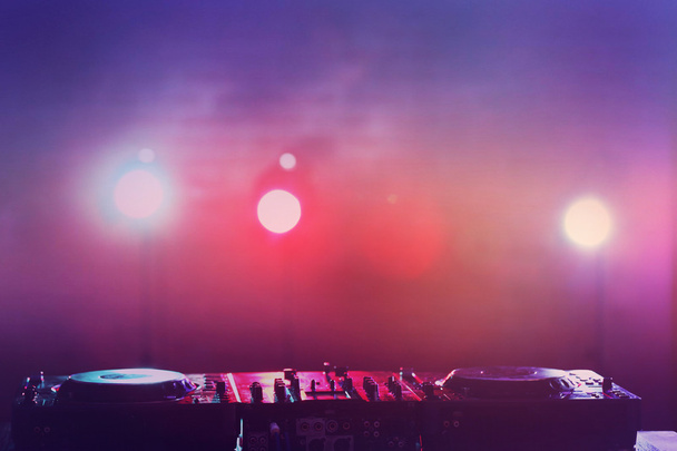 DJ mixer against bright lights - Photo, image