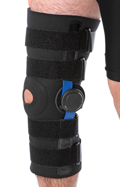 Man wearing a leg brace - Photo, Image