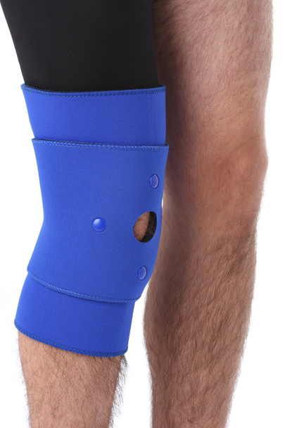 Man wearing a leg brace - Photo, image