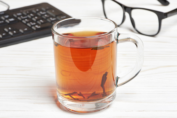 Cup of tea and tea-strainer - Foto, Bild