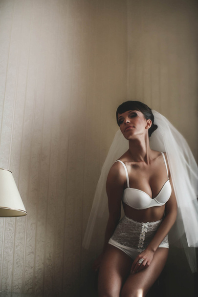attractive bride in whiteness - Foto, Imagen