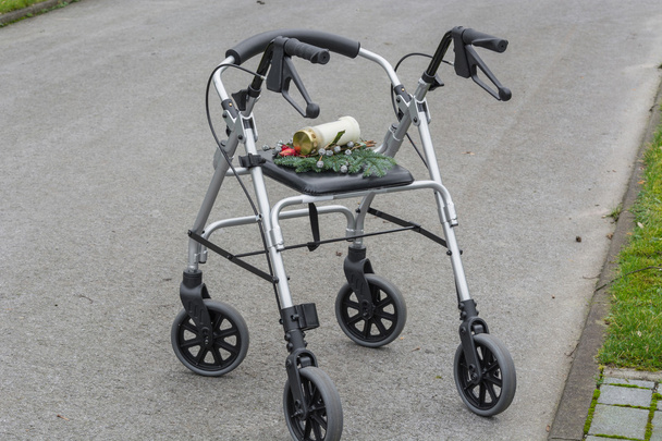 Rollator walker with grave candle     - Photo, Image
