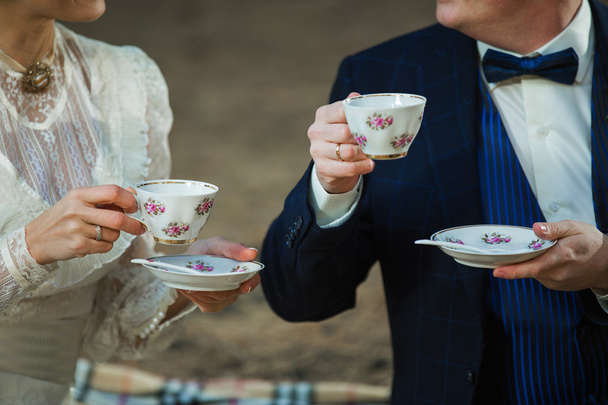 couple drinking tea in nature, close-up of hands - Photo, Image