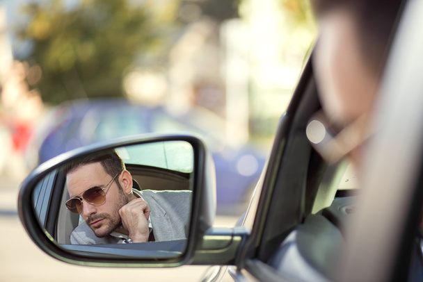 Driver in rear-view mirror - Foto, Imagen