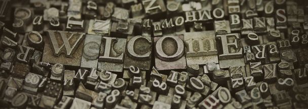 Close up of typeset letters with the word Welcome - Photo, Image