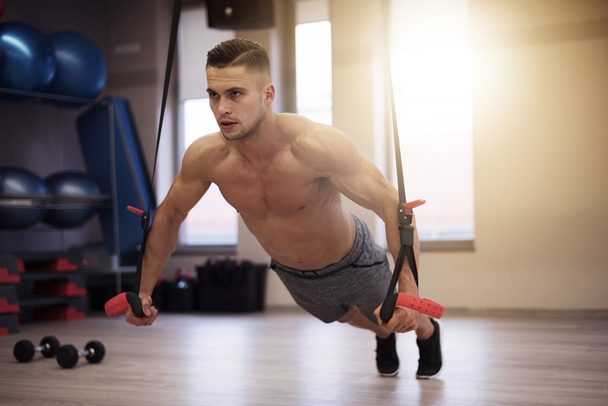 Man stretching at the gym - Foto, imagen