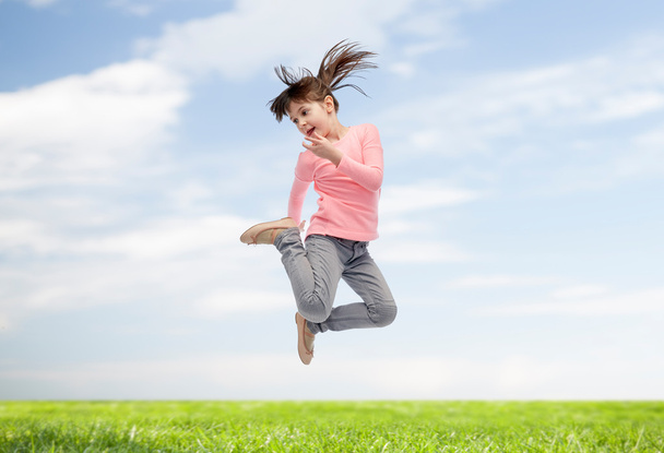 happy little girl jumping in air - Φωτογραφία, εικόνα
