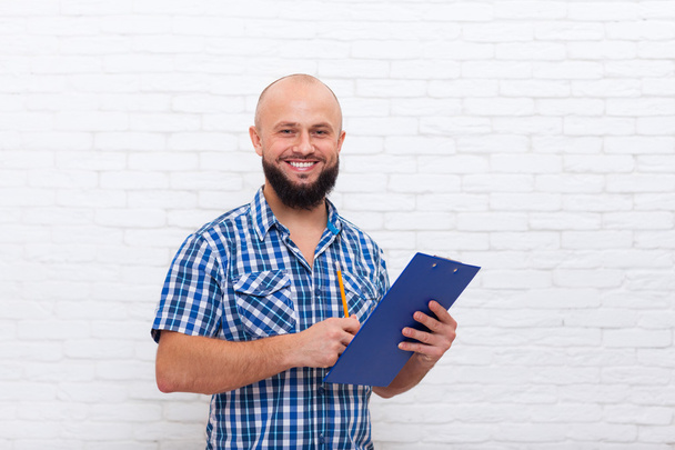 Casual Bearded Business Man Holding Folder Pencil Document Writing Happy Smile - Фото, зображення