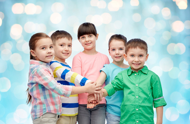 happy little children with hands on top - Foto, Imagen
