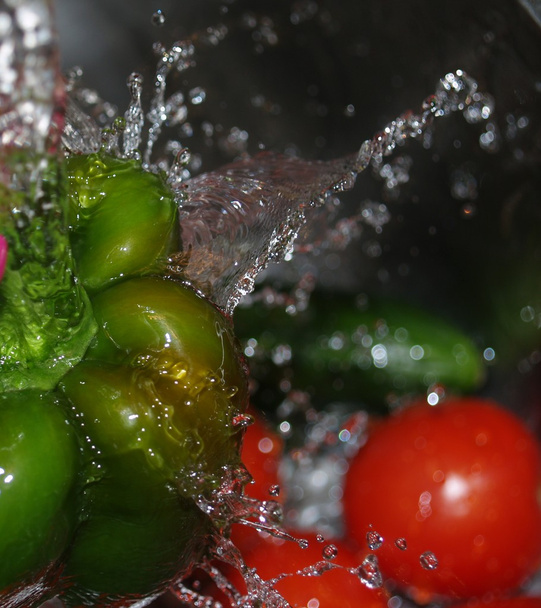 During a fresh bell pepper spray during washing. - Photo, Image