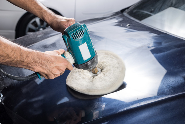 Car detailing series : Worker waxing blue car - Fotografie, Obrázek