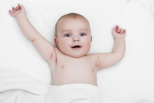 Baby boy playing on his bed - Photo, Image