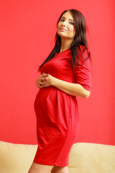 pregnant woman  touching her belly - Fotó, kép