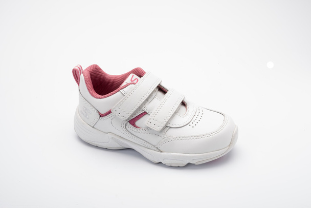 white and pink childrens running shoe on a white background - Photo, Image