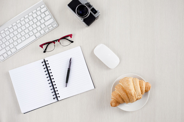 croissant and office supplies  - Foto, Imagen