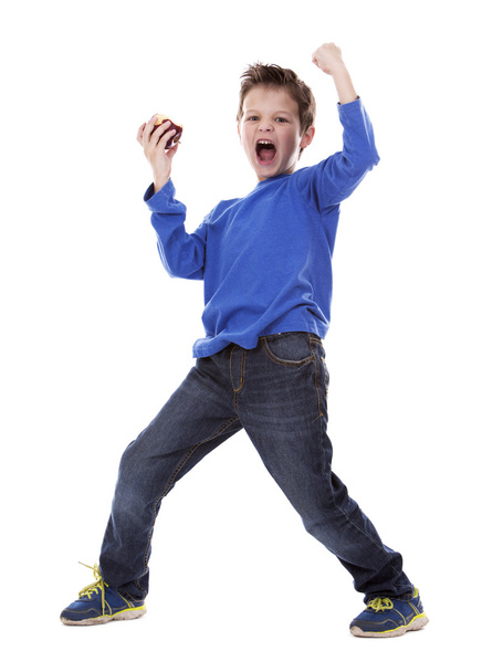 thrilled boy holding and apple - Фото, зображення
