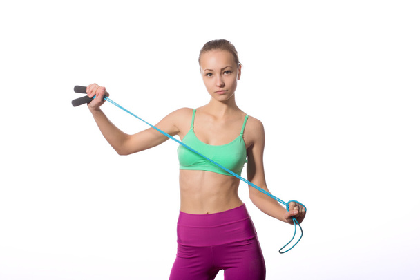 young woman with healthy sporty figure holding skipping rope - Fotoğraf, Görsel