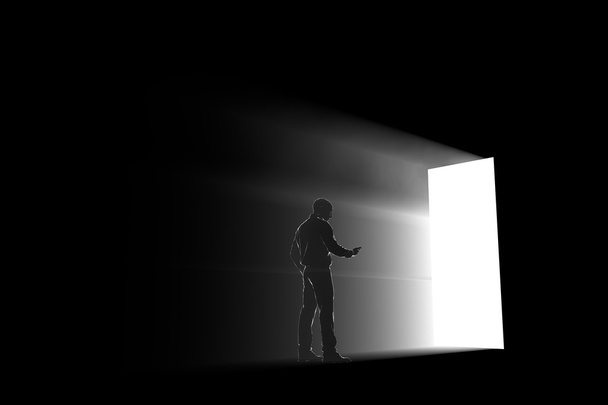 man silhouet verkennen een portal licht - Foto, afbeelding
