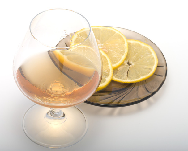Cognac and lemon. - Photo, image