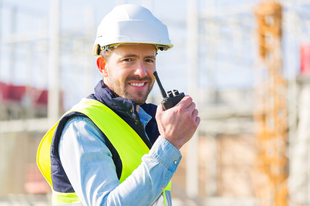 Portrait of an attractive worker on a construction site  - Fotó, kép