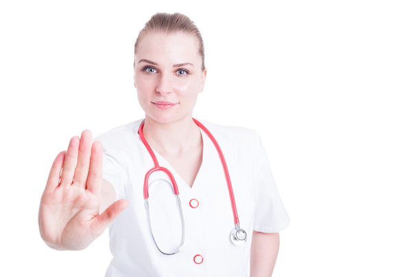 Beautiful woman doctor with stethoscope doing stop gesture - Foto, Imagen