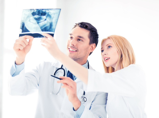 two doctors looking at x-ray - Photo, image