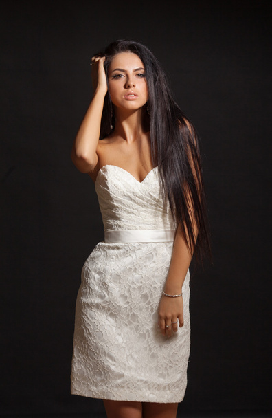 young beautiful caucasian brunette in gorgeous dress - 写真・画像