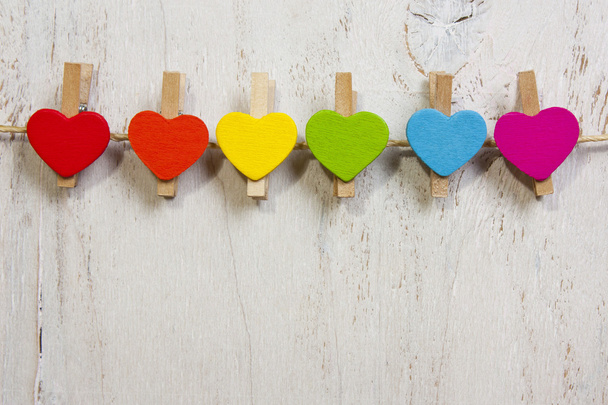 heart rainbow of colors on a white wooden background - Foto, imagen