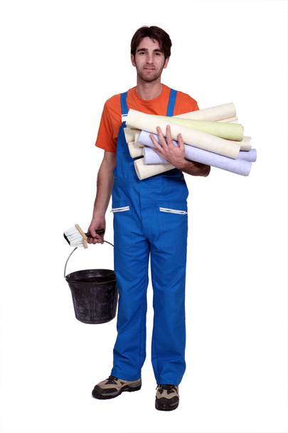Tradesman holding wallpaper rolls - Zdjęcie, obraz
