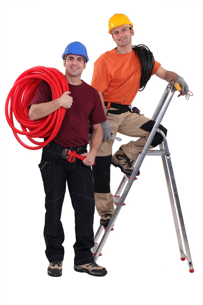 Two electricians working together - Foto, afbeelding