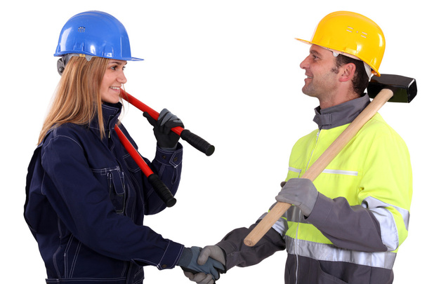 Two construction workers shaking hands - Photo, image