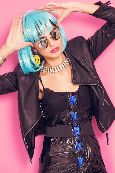Odd girl portrait wearing blue wig and sunglasses - Zdjęcie, obraz