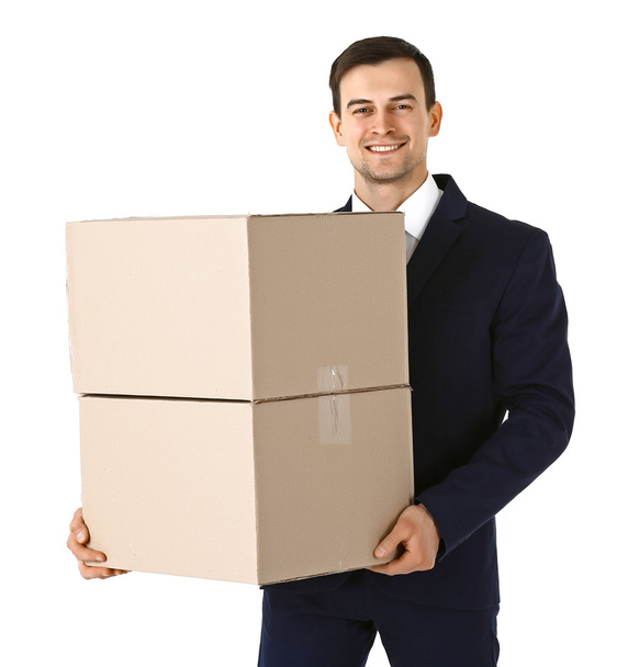 Man in suit holding carton boxes - Foto, Bild