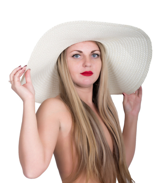 young beautiful woman in a large white hat, isolated on white background - Фото, изображение