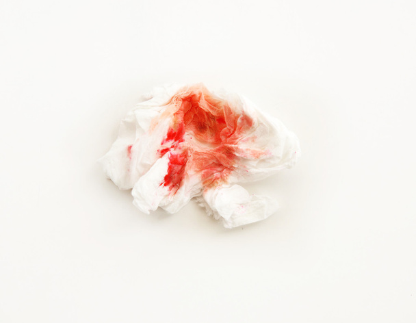 Sangue sobre tecido sobre fundo branco
 - Foto, Imagem