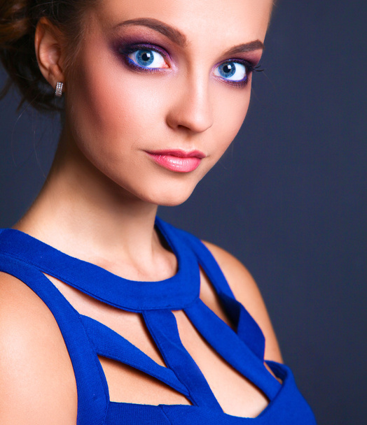 Studio shot of a beautiful young woman wearing professional makeup - Фото, зображення