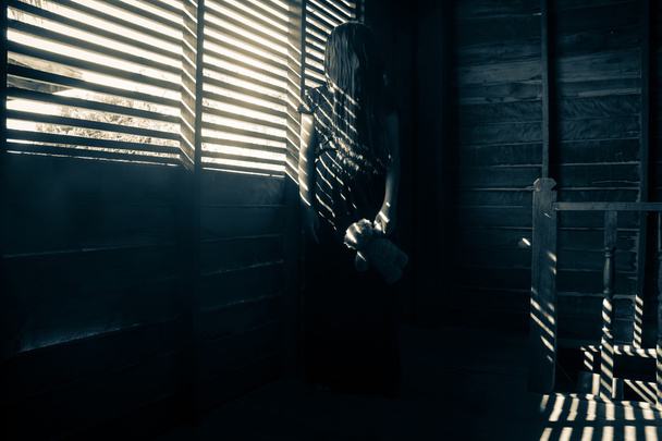 Mysterious girl in black dress standing in abandon house - Valokuva, kuva