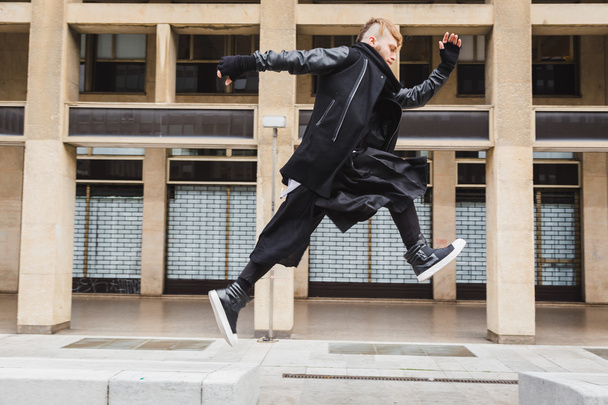 Stylish bearded man jumping in the street - Valokuva, kuva