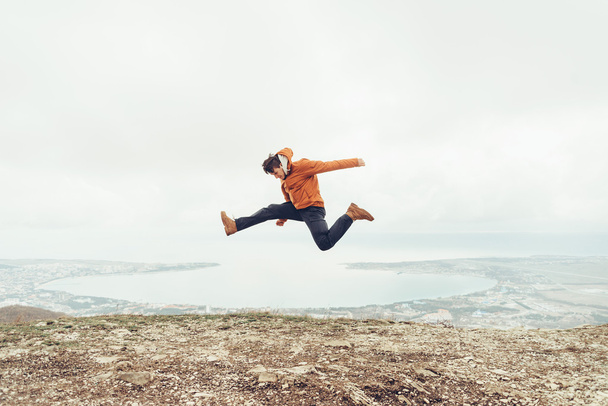 Happy guy jumping outdoor  - Valokuva, kuva