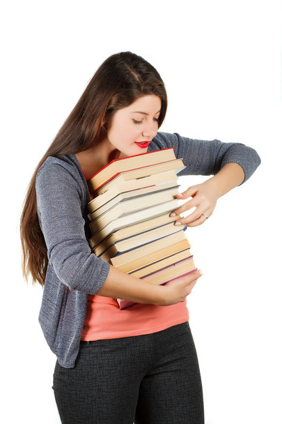 Mädchen mit Büchern isoliert auf weißem Hintergrund. - Foto, Bild