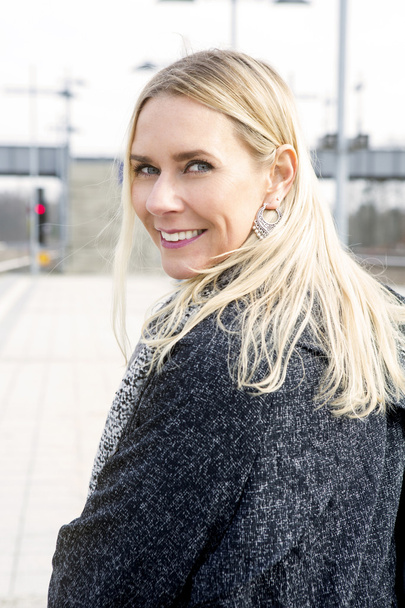 portrait of blond woman at train station - Fotoğraf, Görsel